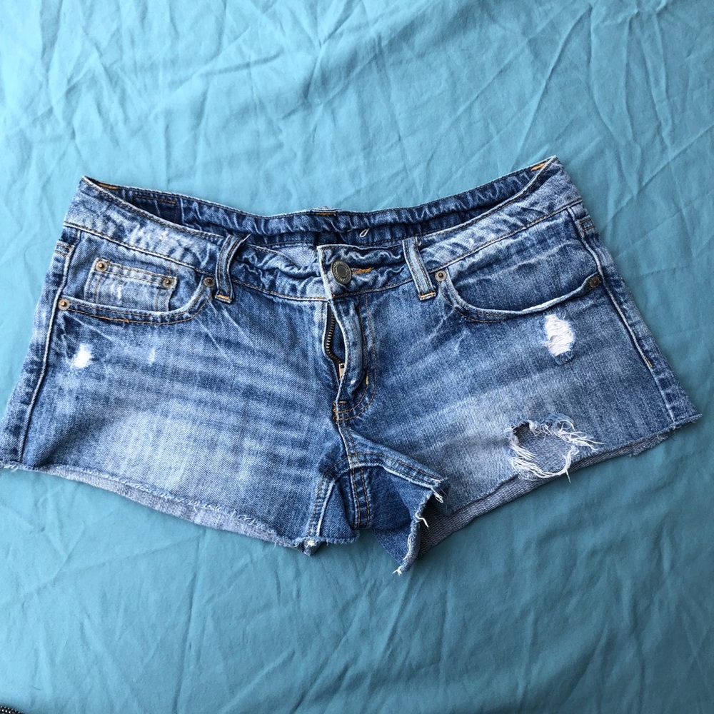 Distressed blue jean shorts